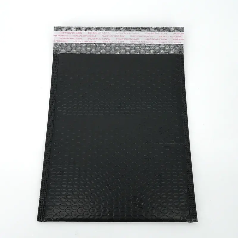 Black bubble mailer with an exposed adhesive sealing strip.