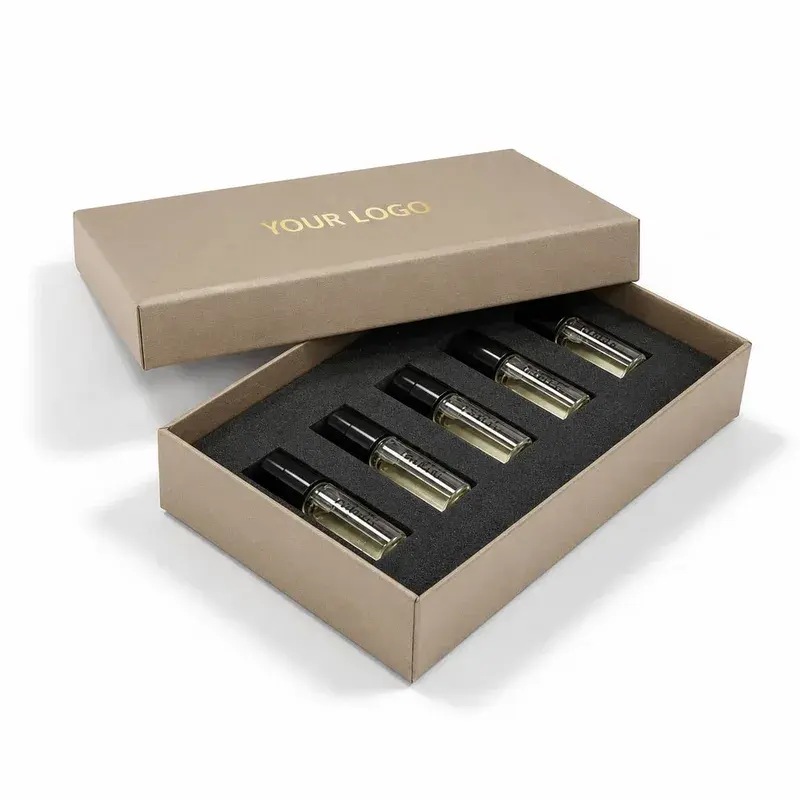 Beige presentation box with a black tray holding small perfume bottles.