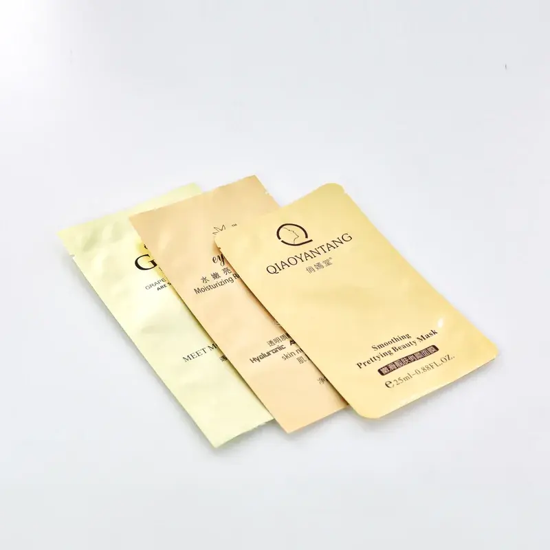 Overlapping beige flat pouches with dark printed lettering.