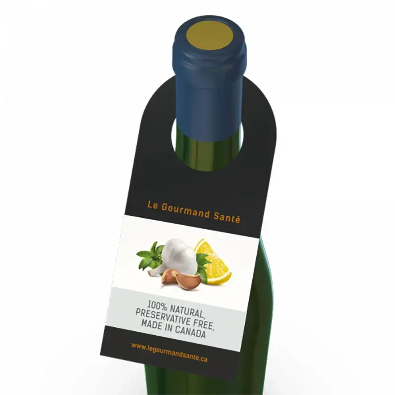 Dark bottle with a black neck tag and a white illustrated panel.