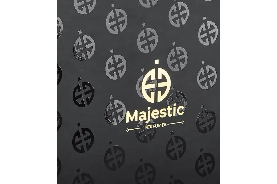 Black patterned paper with a gold-colored emblem and lettering.