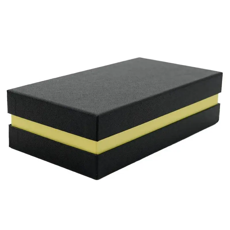 Closed black box with a gold-colored band around its middle.