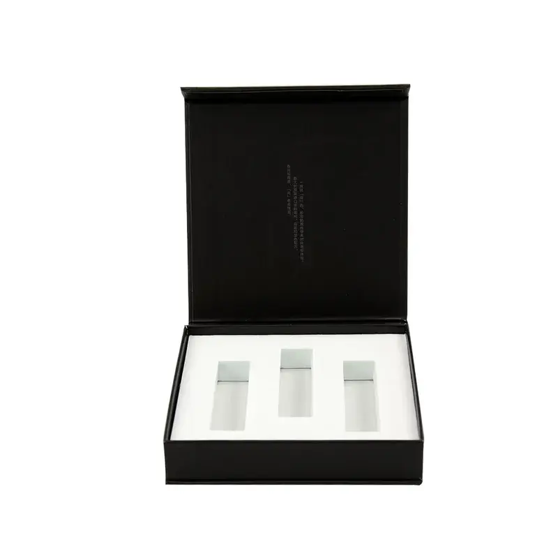 Front view of an open black box with a white fitted insert.