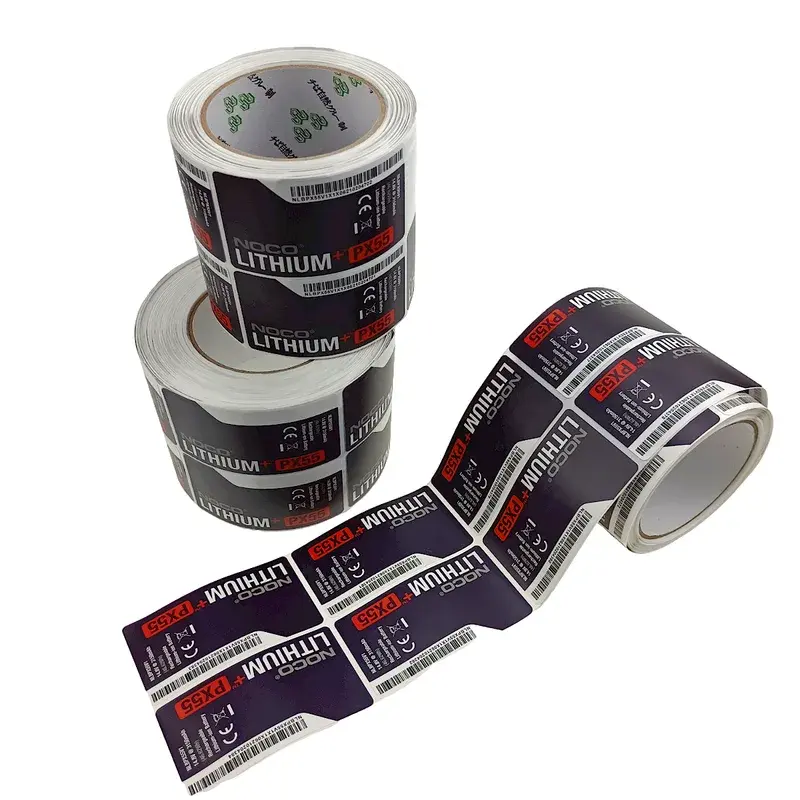 Black printed label rolls with loose labels extending outward.