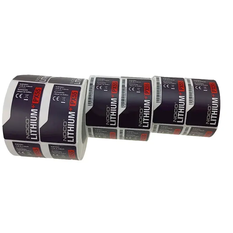 Black printed labels extending from a horizontal roll.