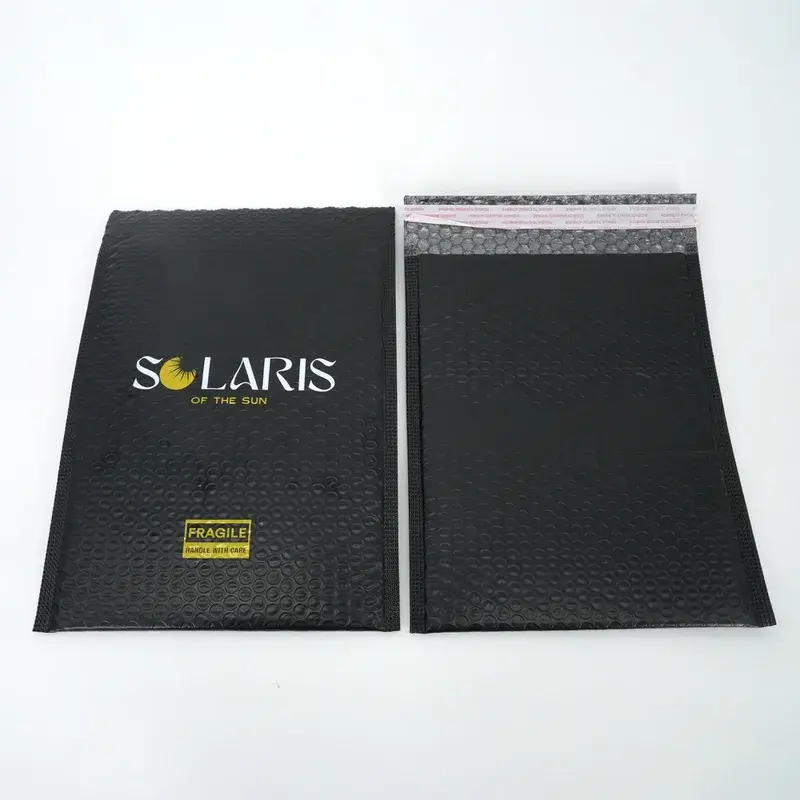 Black bubble mailers showing printed fronts and adhesive backs.