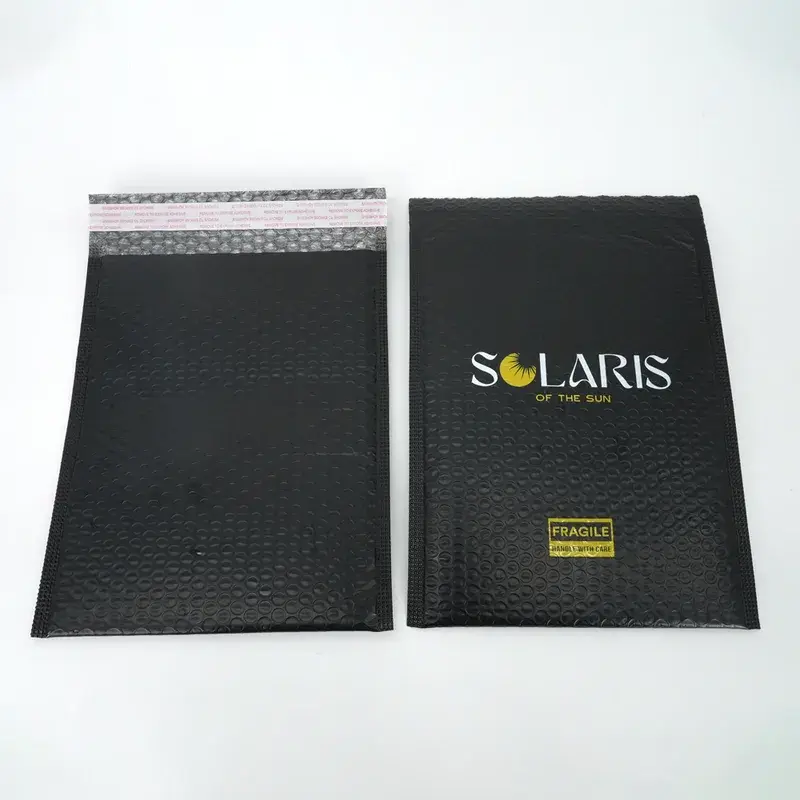 Black bubble mailers showing printed fronts and adhesive backs.