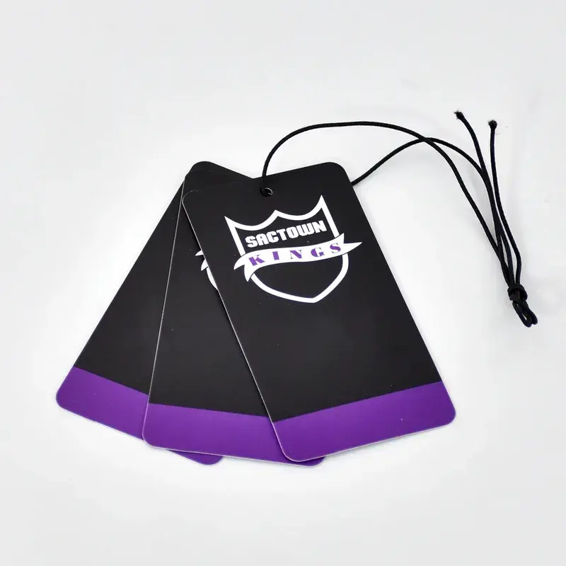 Black tags with purple lower edges and looped cords.