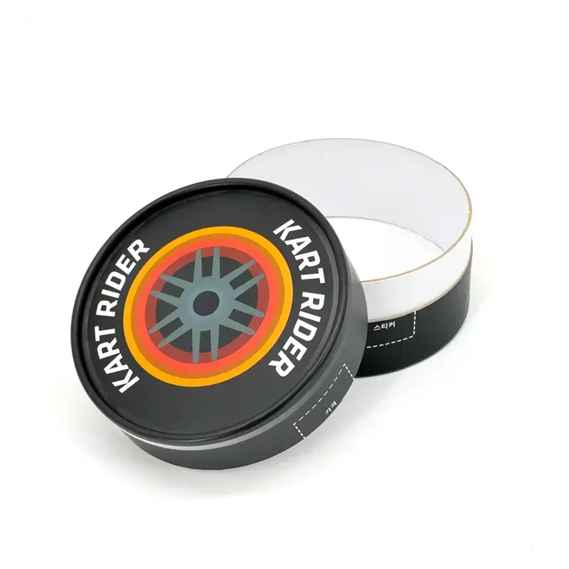 Open black round box beside its printed lid.
