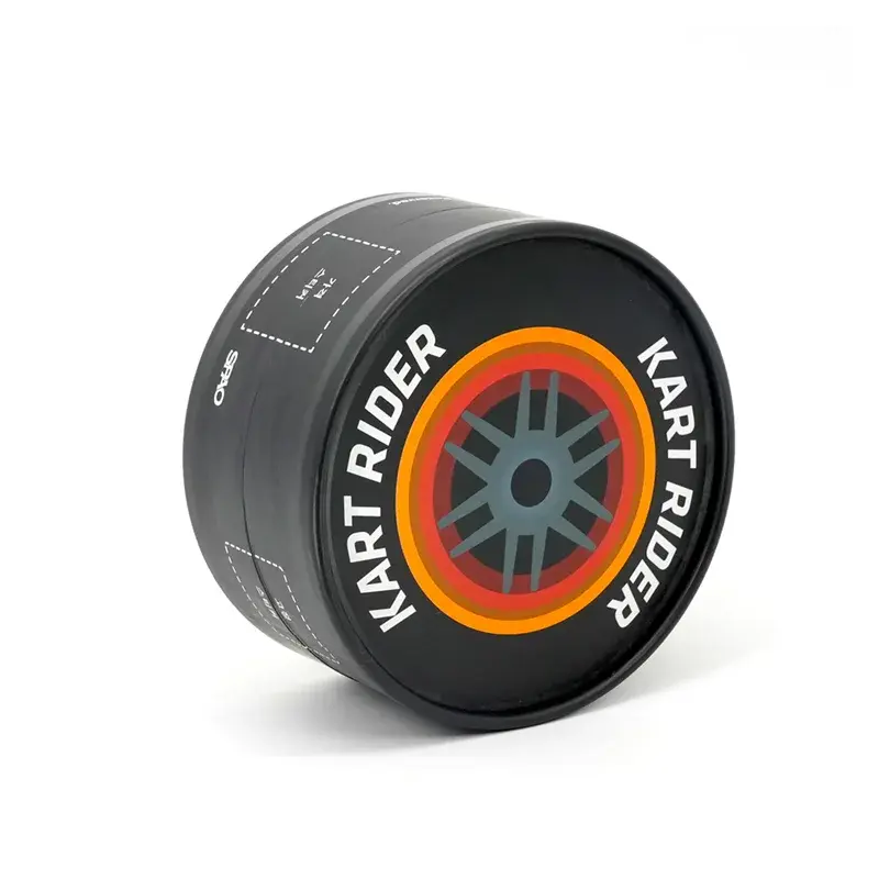 Black round box resting on its side with its printed lid visible.