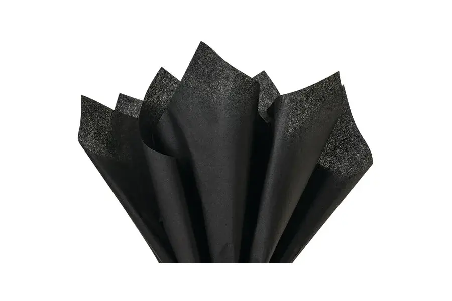 Black textured tissue sheets arranged in a fan.