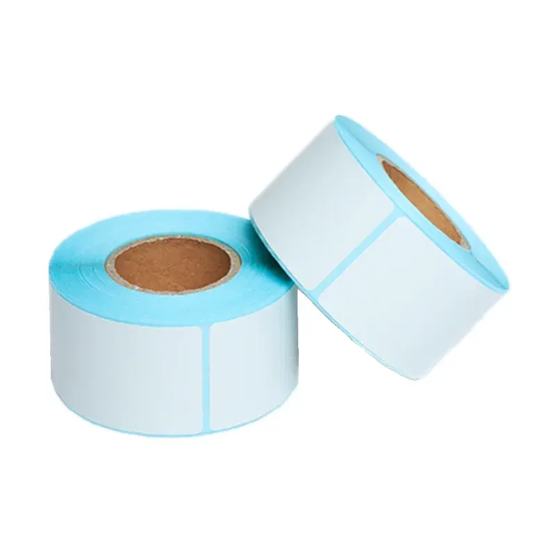 Two rolls of white blank labels on pale blue backing paper.