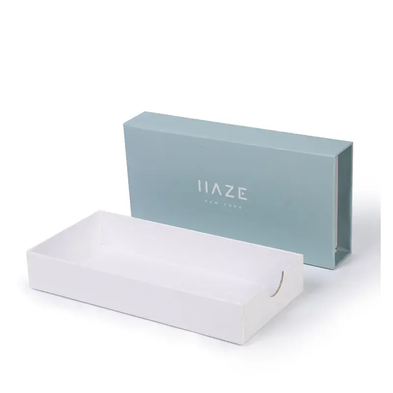 Pale blue drawer box beside its empty white inner tray.