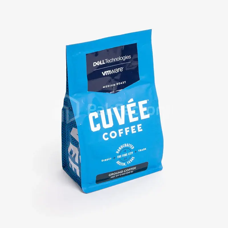 Blue coffee bag with white lettering and a broad folded base.