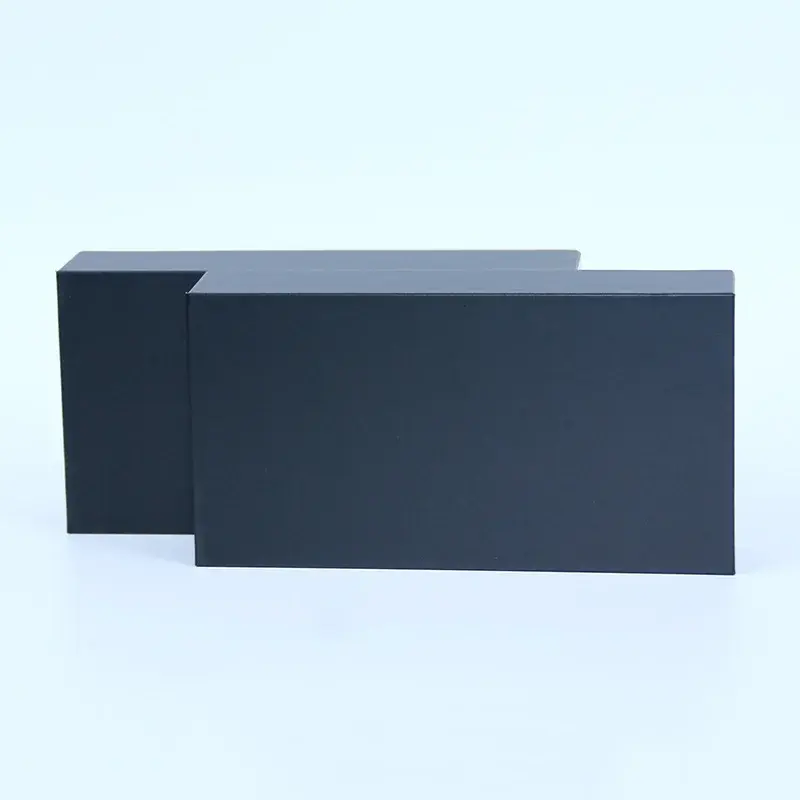 Two plain dark blue rectangular packaging boxes.