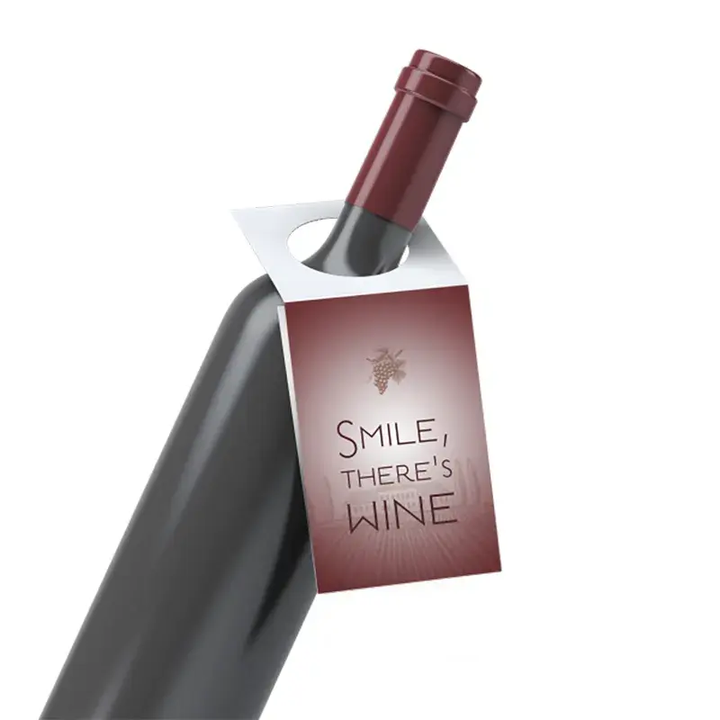Dark wine bottle with a pink printed neck tag.