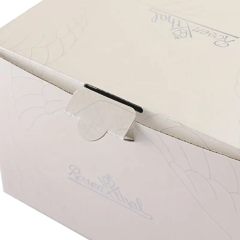Close view of a small tab tucked into a cream carton lid.