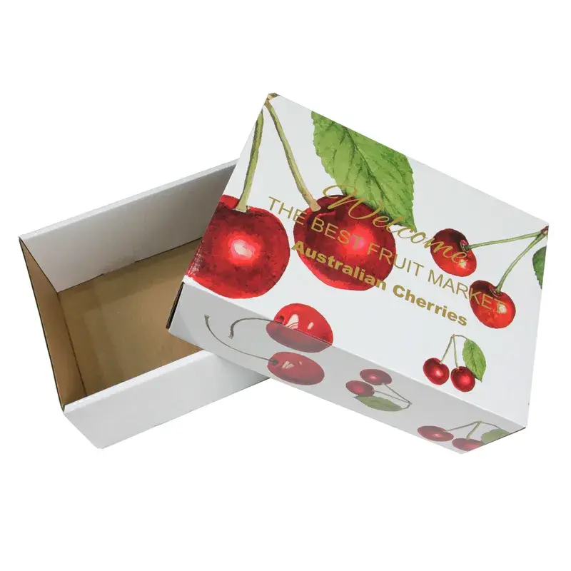 Open white box beside a lid printed with red cherries.