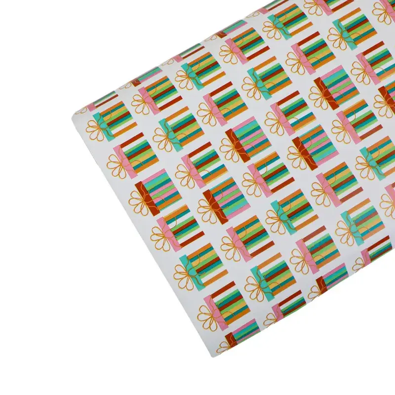 Partly unrolled wrapping paper with a colorful repeating pattern.
