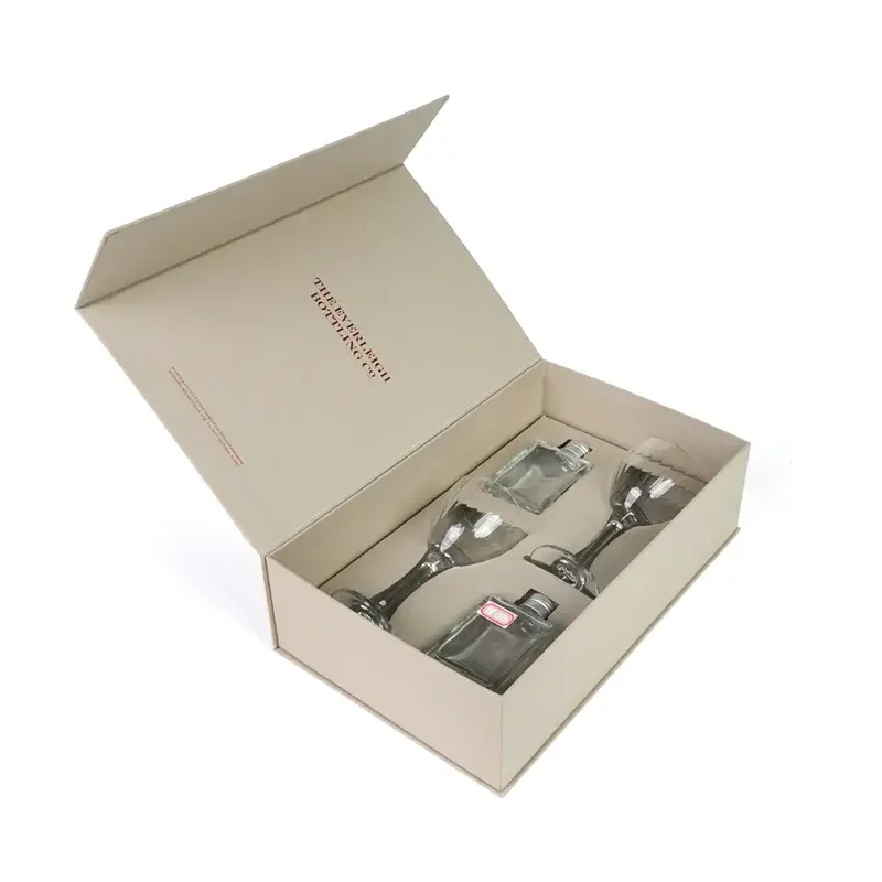 Angled view of an open cream gift box holding glassware.