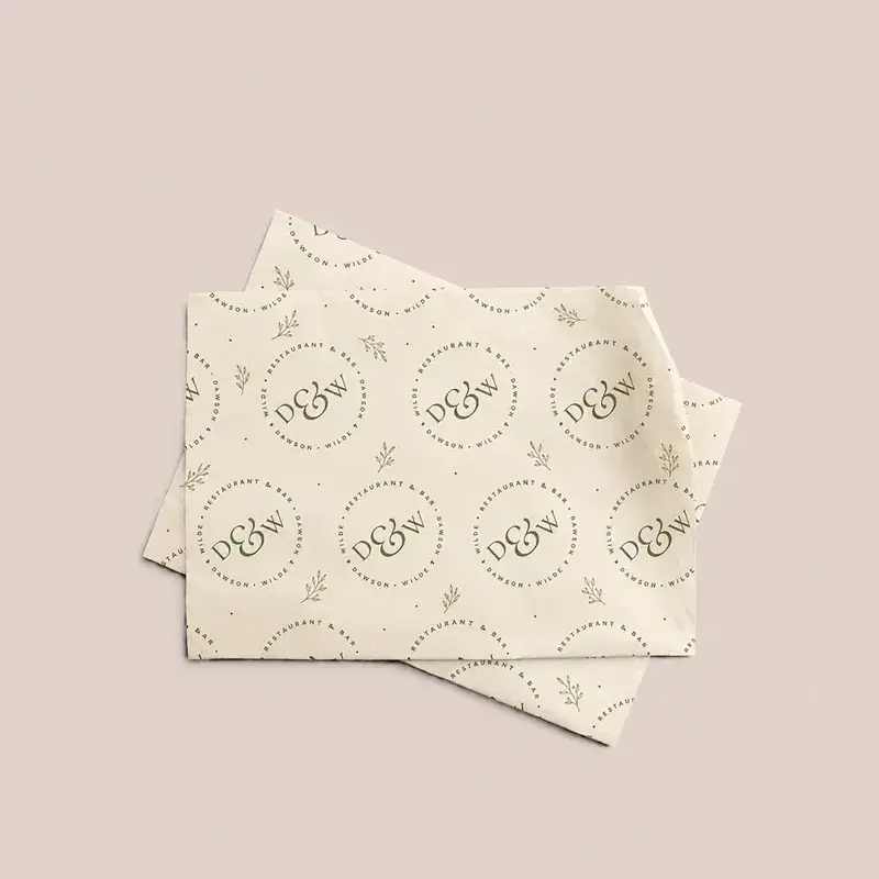 Cream paper sheets with repeating circular printed emblems.