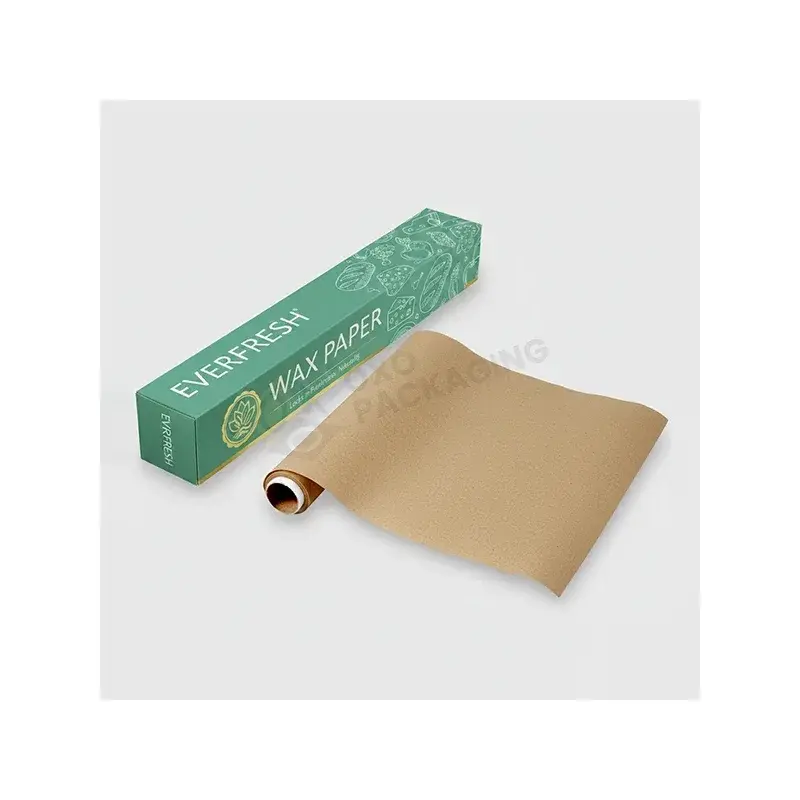 Green dispenser box beside a partly unrolled brown paper sheet.