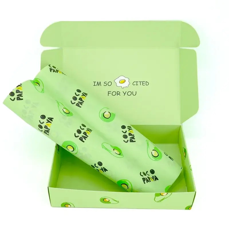 Open green mailer containing matching avocado-patterned tissue.