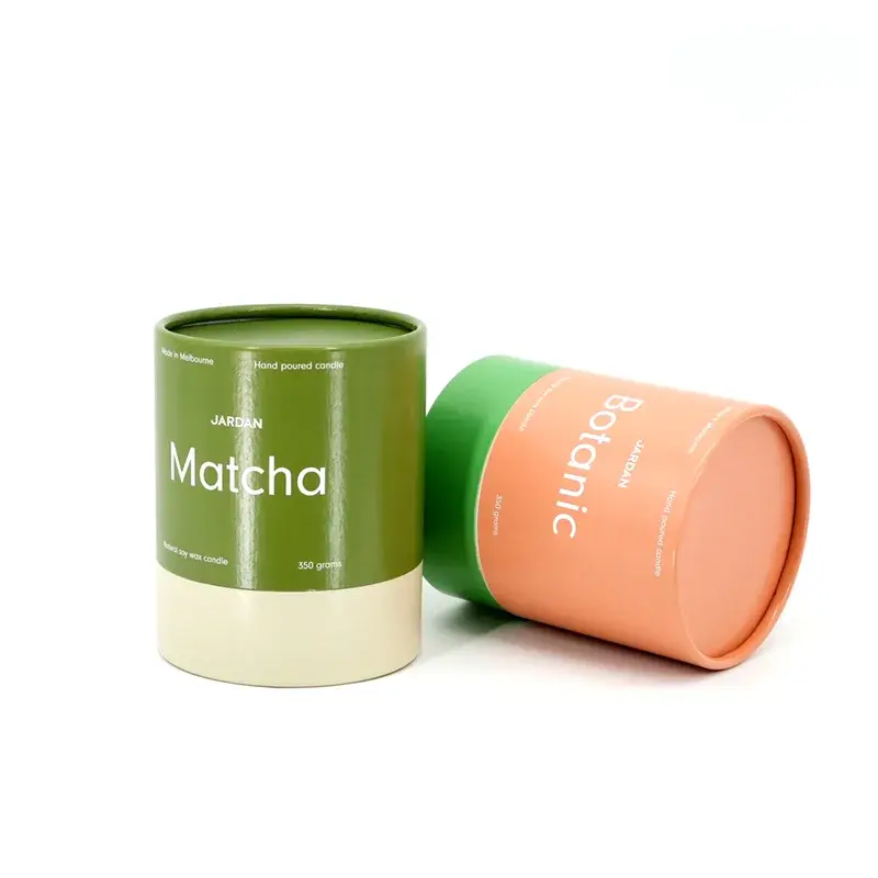 Green and orange cylindrical boxes with pale bases.