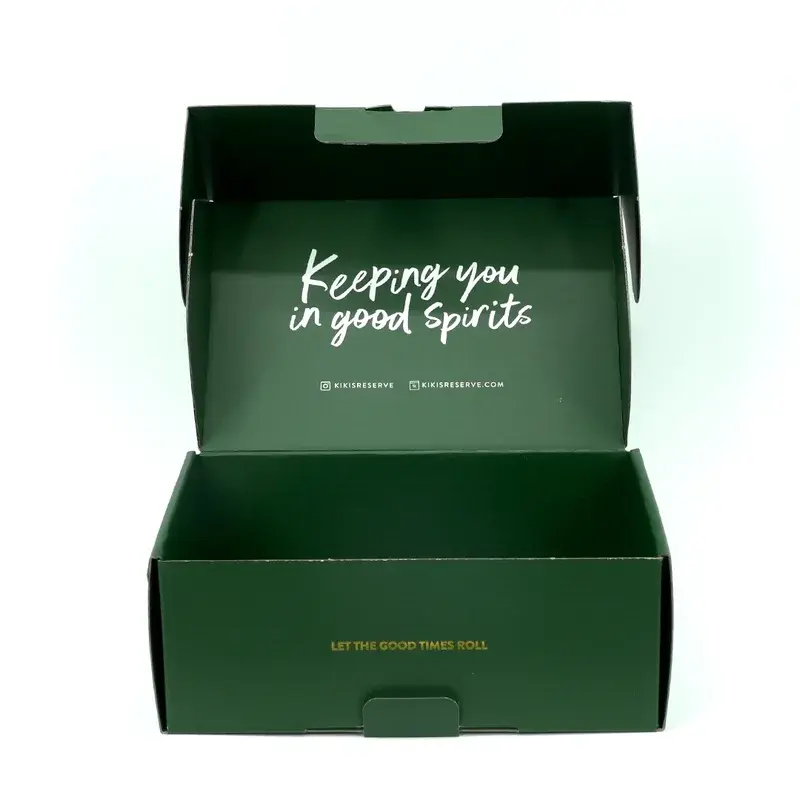 Open dark green mailer with white lettering inside the lid.
