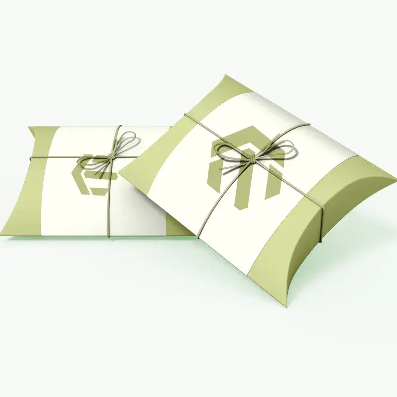 Green and white pillow boxes with printed ribbon graphics.