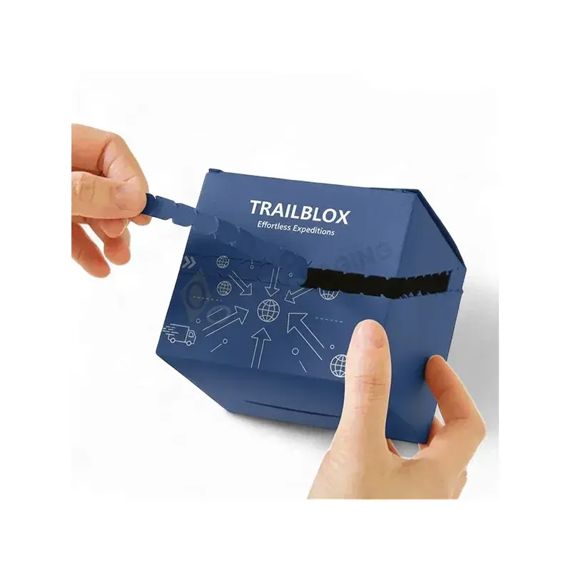 Hands pulling a strip across a blue printed carton.