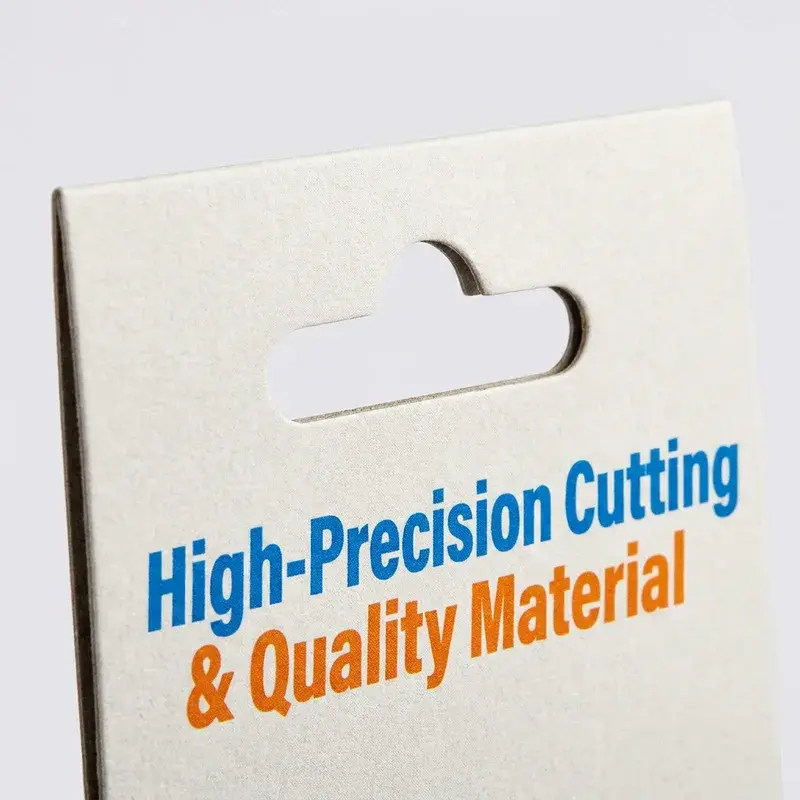 Close view of a white header card with a shaped hanging slot.