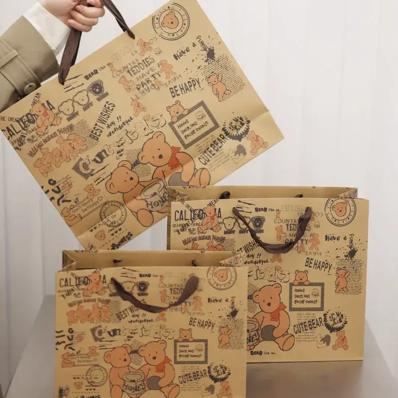 Kraft shopping bags with dark illustrations and cord handles.