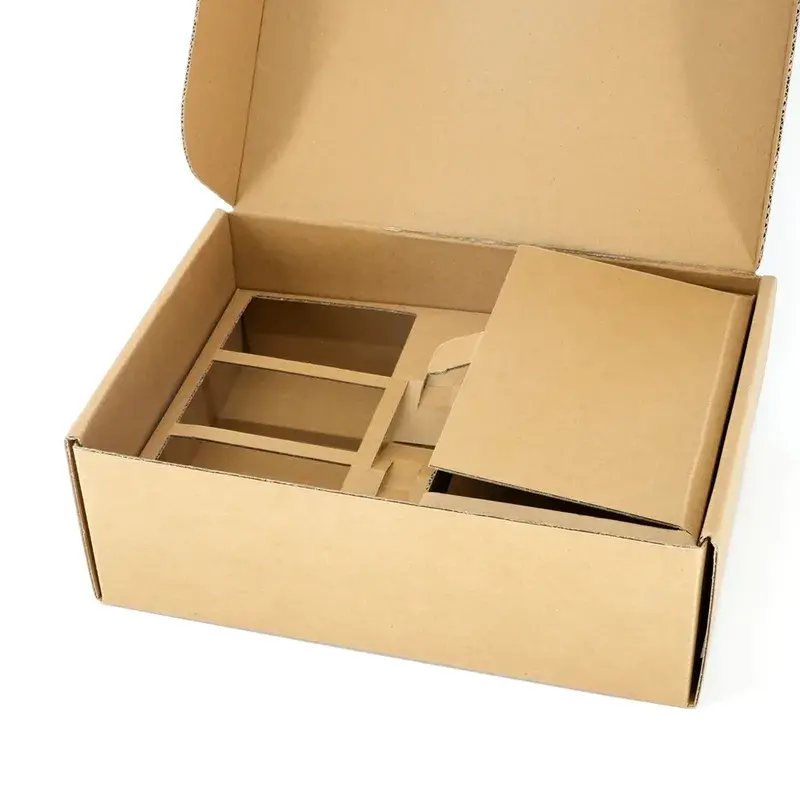Open kraft box with divided compartments and a covered section.