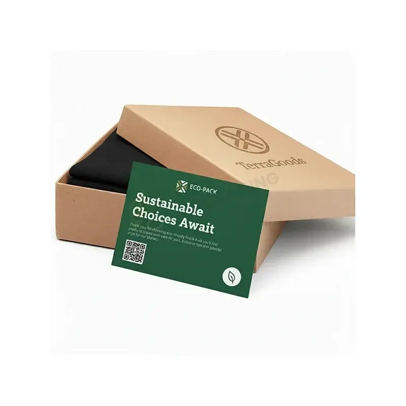 Kraft gift box with a green printed card across its front.