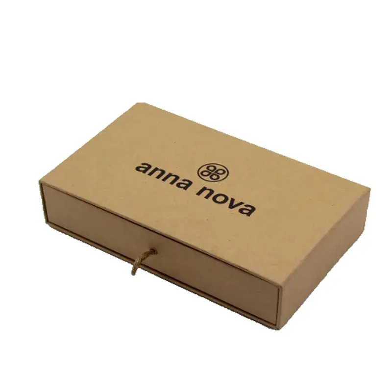 Closed kraft drawer box with dark lettering and a loop pull.