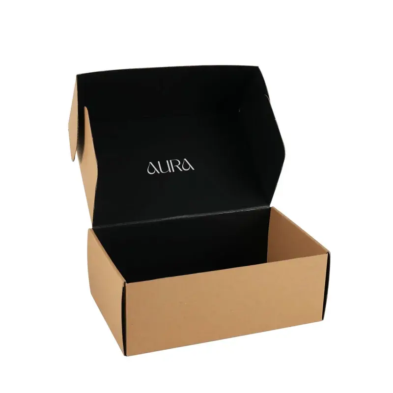 Open kraft mailer with a black printed interior lid.