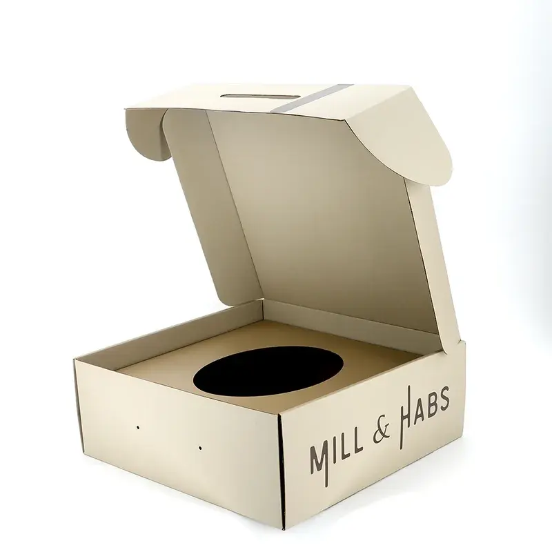 Kraft box viewed from a front corner with its insert visible.