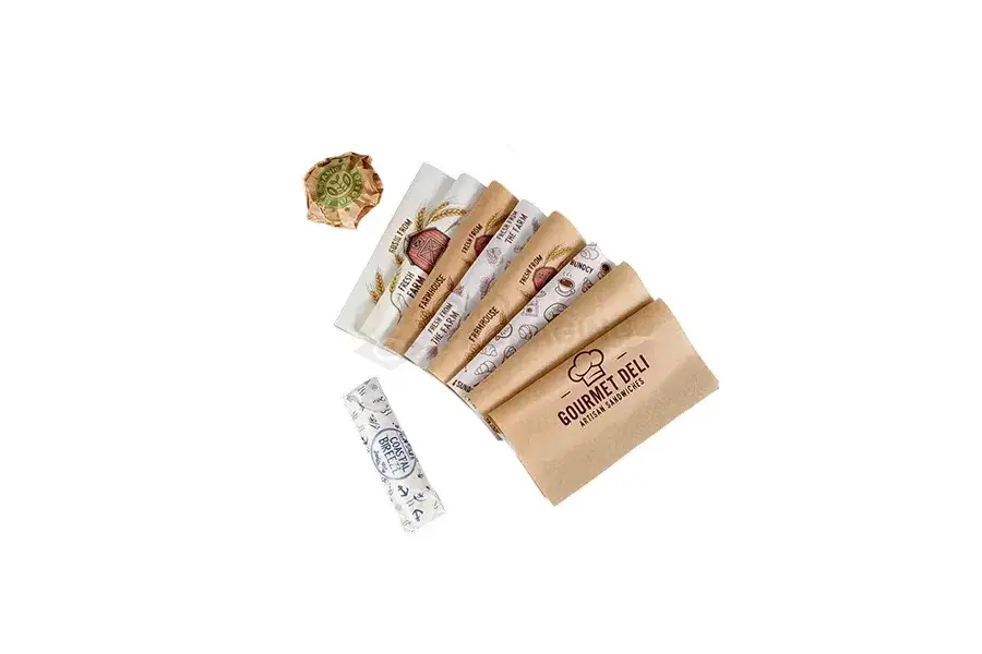 Printed kraft paper bag holding wrapped sandwiches.