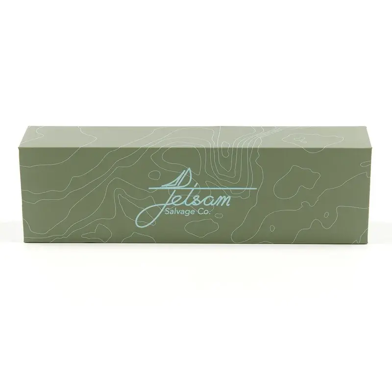 Closed long green presentation box with pale decorative lines.