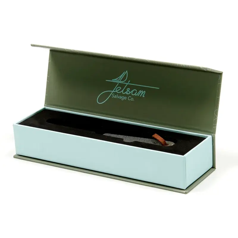 Long green presentation box with a fitted dark interior.