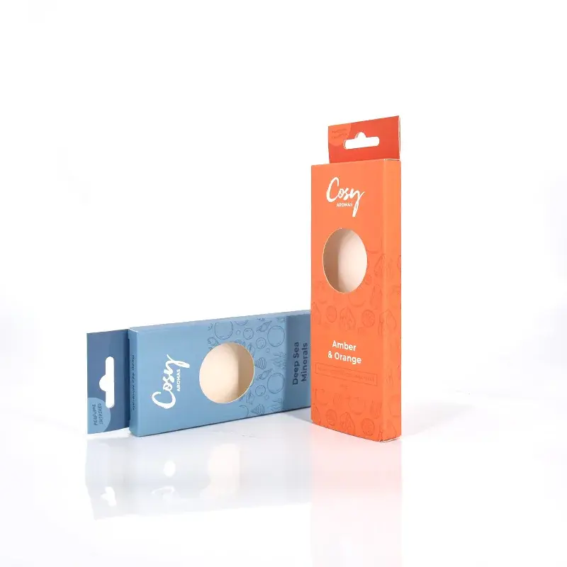 Tall orange window carton beside a small blue carton.
