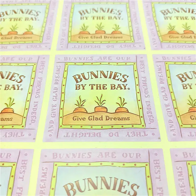 Close view of pastel labels with printed lettering and borders.