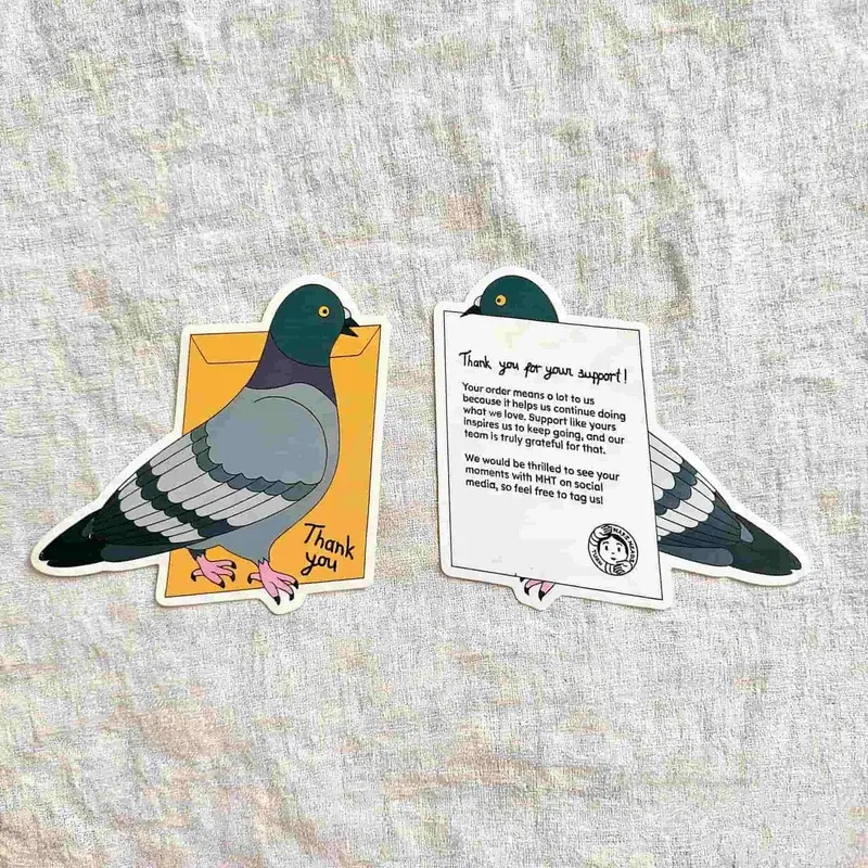 Pigeon-shaped illustrated cards showing front and printed reverse.
