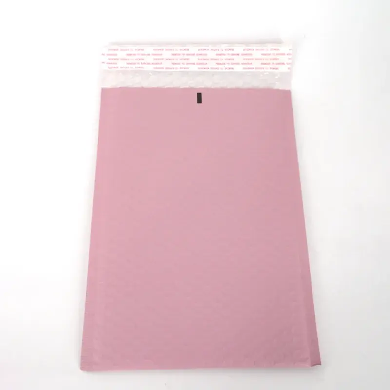 Pink bubble mailer with its adhesive closure exposed.