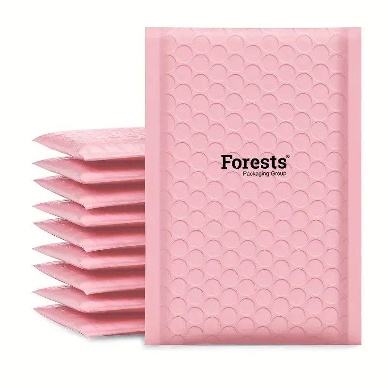 Stack of pink bubble mailers with black printed lettering.