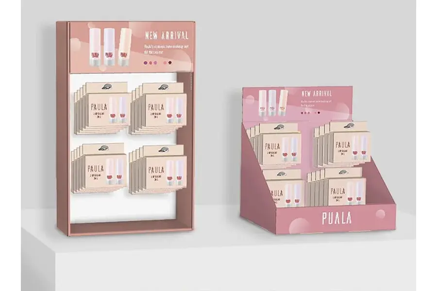 Pink countertop displays holding rows of small printed cards.