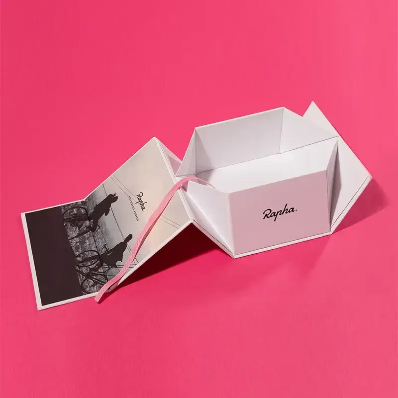 Pink gift box displayed with its folded side panels open.
