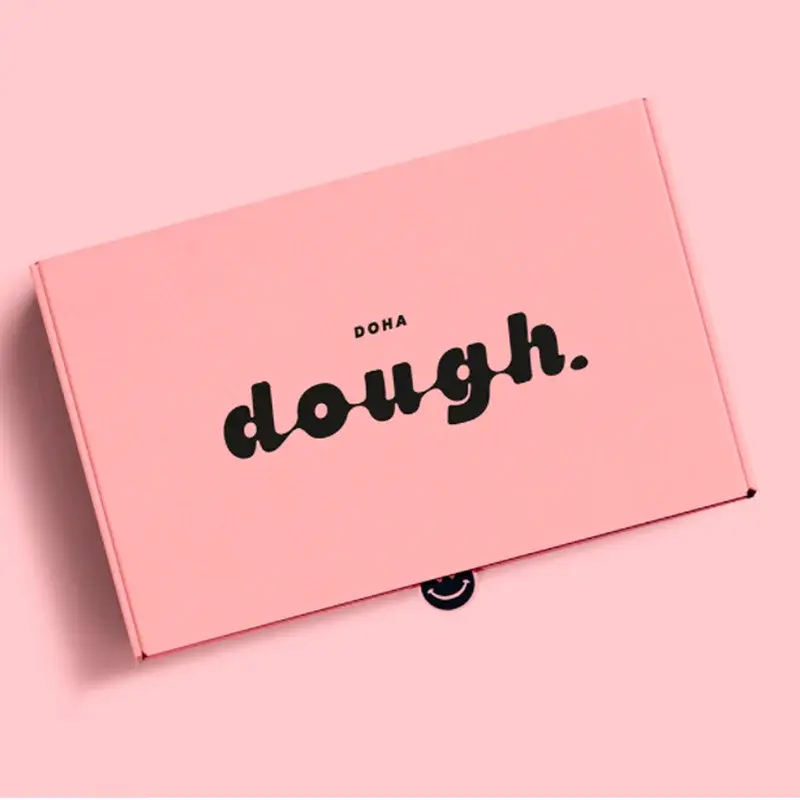 Closed pink cookie box with bold black lettering.