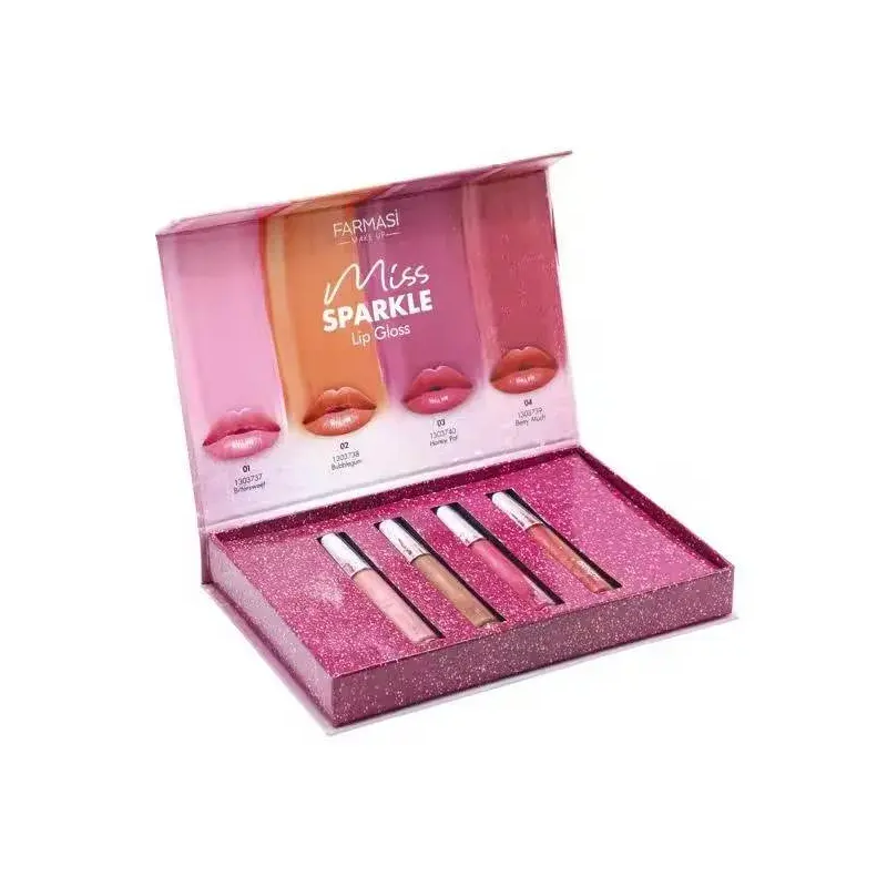 Open pink presentation box holding a row of lip gloss tubes.